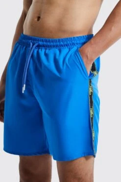 Tall Mid Length Ofcl Tape Swim Shorts 7 Tall Mid Length Ofcl Tape Swim Shorts -Ocean Streetwear male cobalt tall mid length ofcl tape swim shorts 3