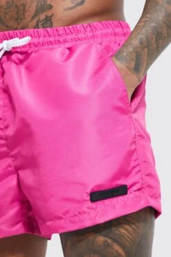 Short Length Limited Rubber Tab Swim Shorts 7 Short Length Limited Rubber Tab Swim Shorts -Ocean Streetwear male fuchsia short length limited rubber tab swim shorts 3